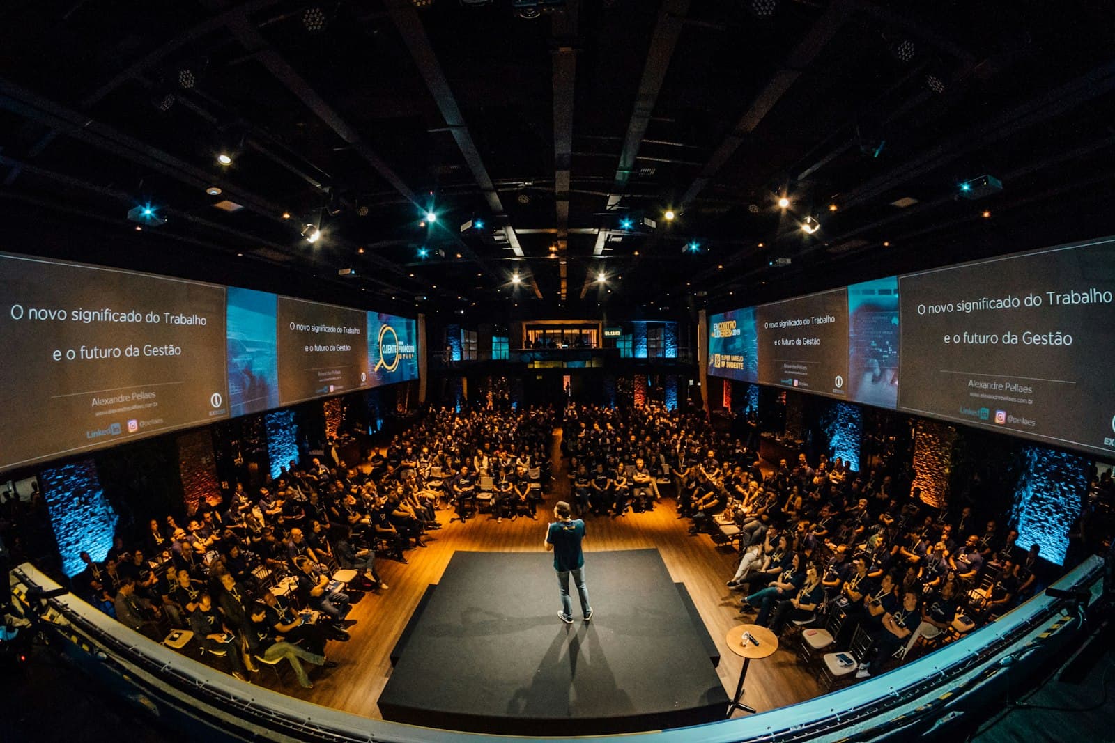 A room full of people listening to a speaker at a tech community event