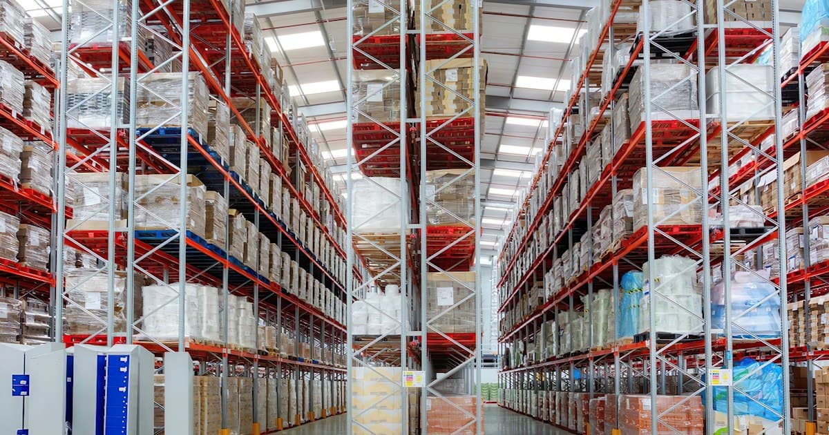 Tall racking full of pallets. At a wholesaler of 120 people this can easily hold a few million euros, and the ERP knows per item how fast it turns.